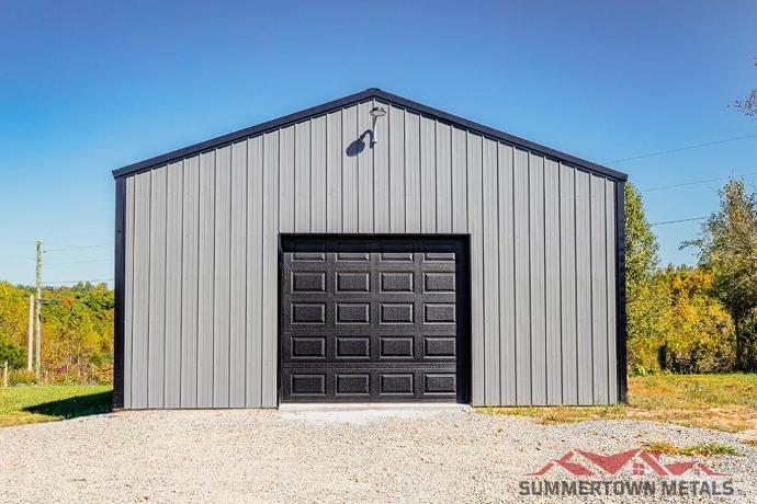 24x30x10 garage with gray siding, black accents, and black garage door
