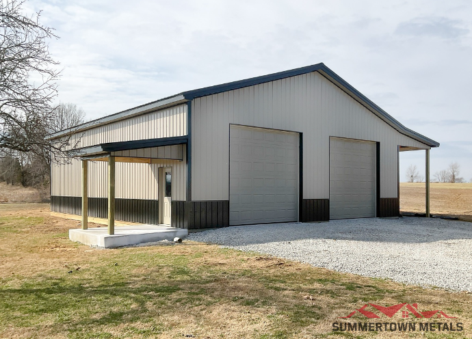 40x50x14 shop with taupe siding, dark roof and accents, and two car garage doors