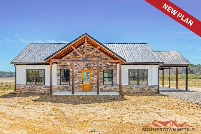 Smaller Willow Creek barndominium with white siding, black roof, single entry, and stone exterior accents